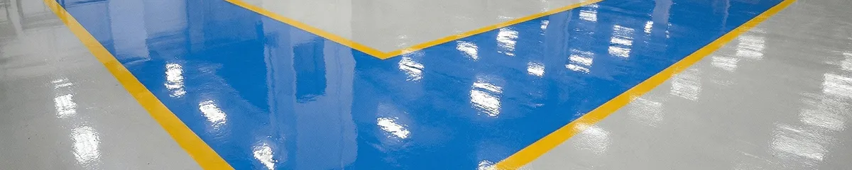 A factory floor professionally covered and marked with epoxy flooring in Peoria, IL