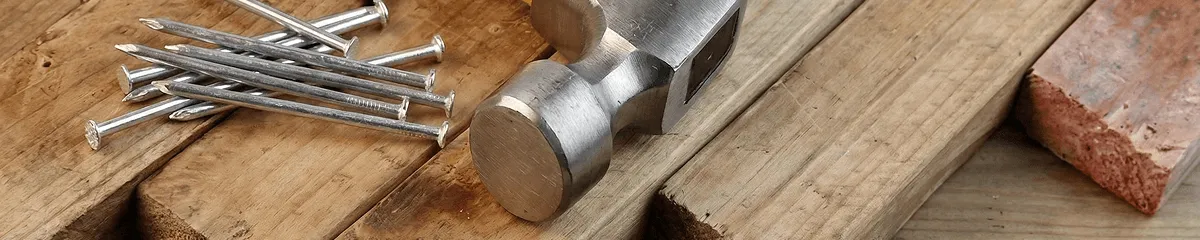 Hammer and nails on hardwood flooring boards in Peoria, IL