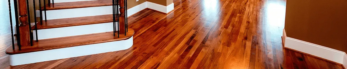 Base floor of a staircase with professionally restored wood flooring in Peoria IL
