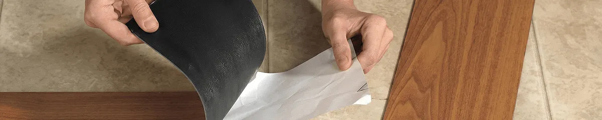 A professional installing vinyl flooring in Peoria, IL